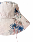 Close-up of Wild Palms bucket hat showing palm tree print, woven fabric and stitched brim