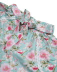 Close-up of Blossom print cotton shorts showing self-tie drawstring waistband and lace trim detail