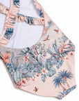 - Close-up of the crossed frill straps, low back and tropical jungle print on the Girls Frill Cross Back One Piece swimsuit