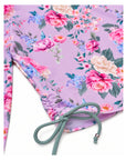 Girls Long Sleeve 2 Piece Swim Set in Violetta floral print – close-up of side ruching and tie detail