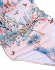 Close-up of braided belt and Wild Palms tropical print on the Girls T-Back One Piece Swimsuit