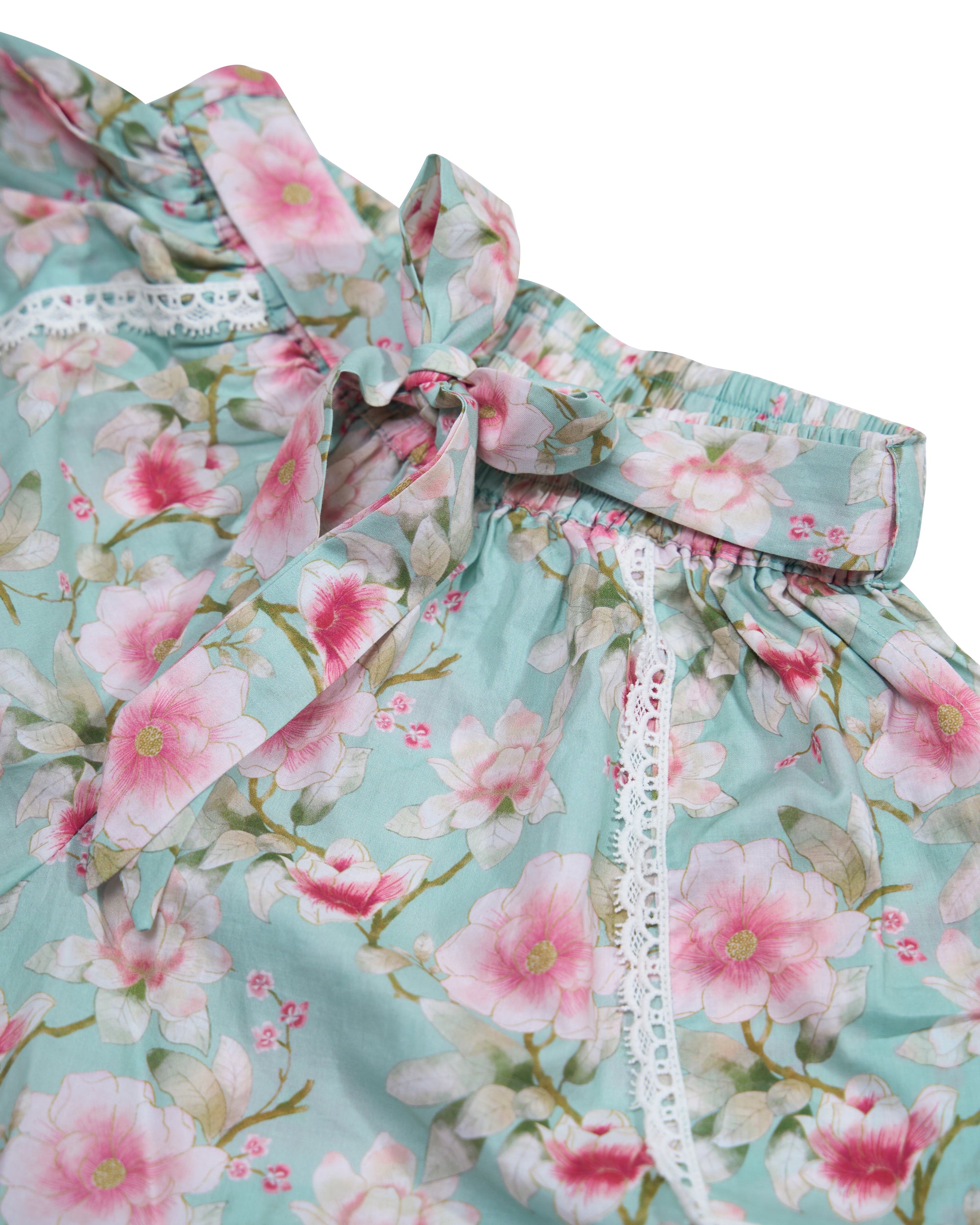 Close-up of Blossom print cotton shorts showing self-tie drawstring waistband and lace trim detail