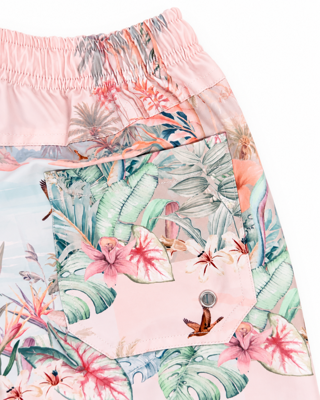 Close-up of the back pocket and silver drainage eyelet on Boys’ Wild Palms board shorts.