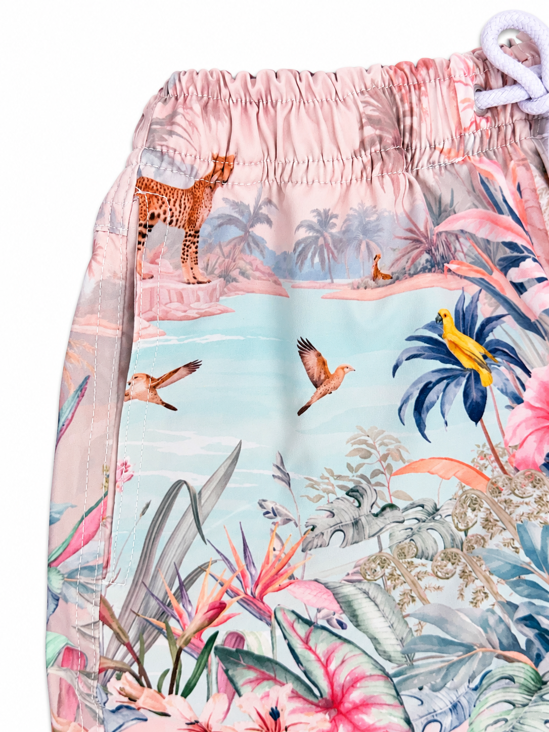 Close-up of the waistband, side seam and tropical print on Boys’ Wild Palms board shorts.