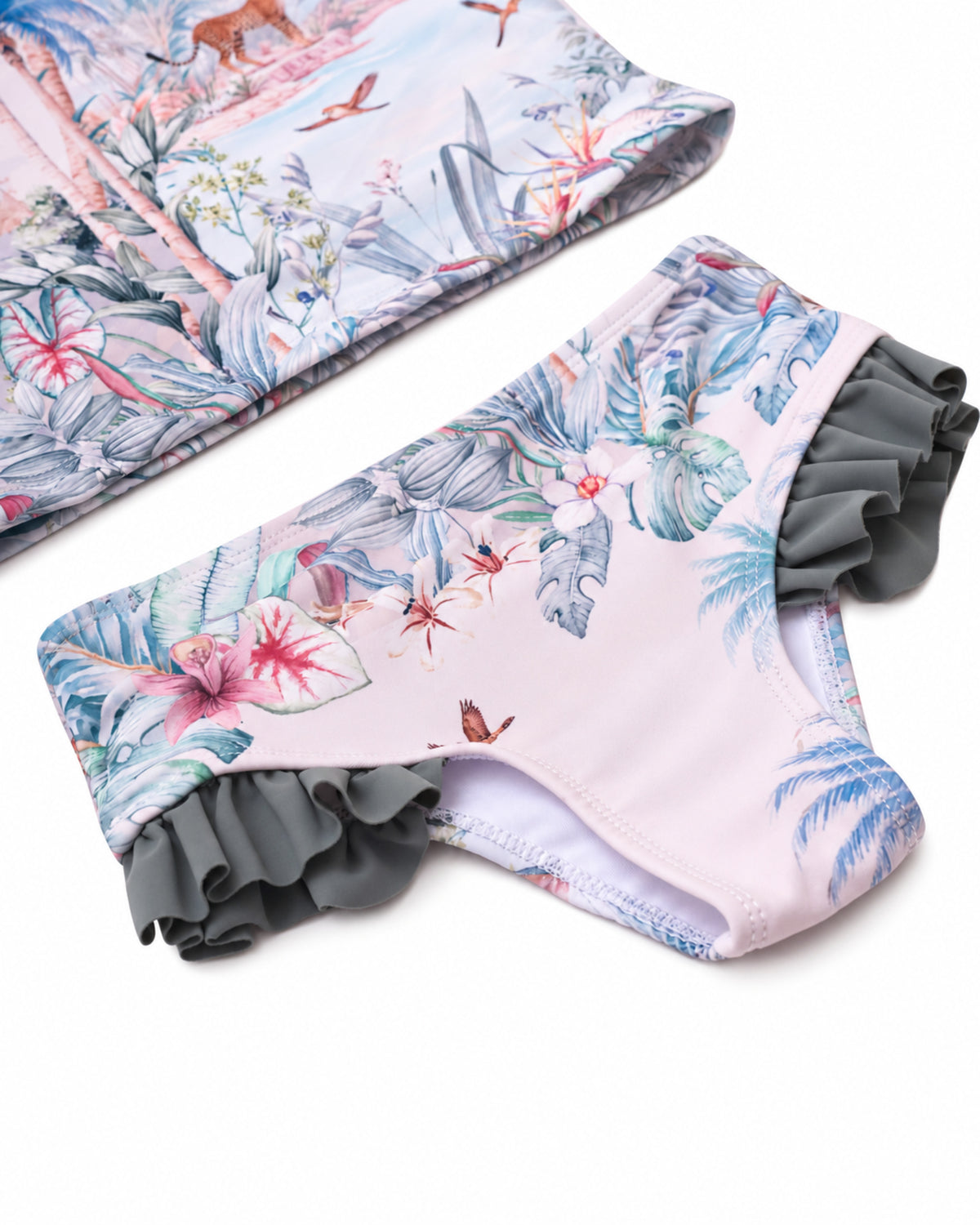Girls 2 Piece Swim Set in Wild Palms jungle floral print, close-up of the bikini bottoms with side frill detail.