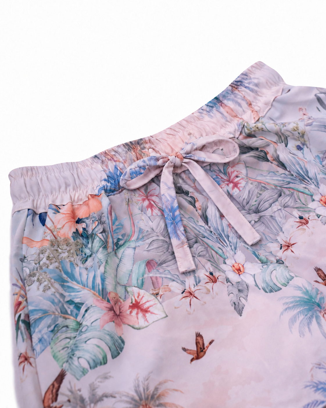 Close-up of the fabric bow and elastic waistband on Girls’ Wild Palms board shorts.