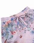 Close-up of the fabric bow and elastic waistband on Girls’ Wild Palms board shorts.