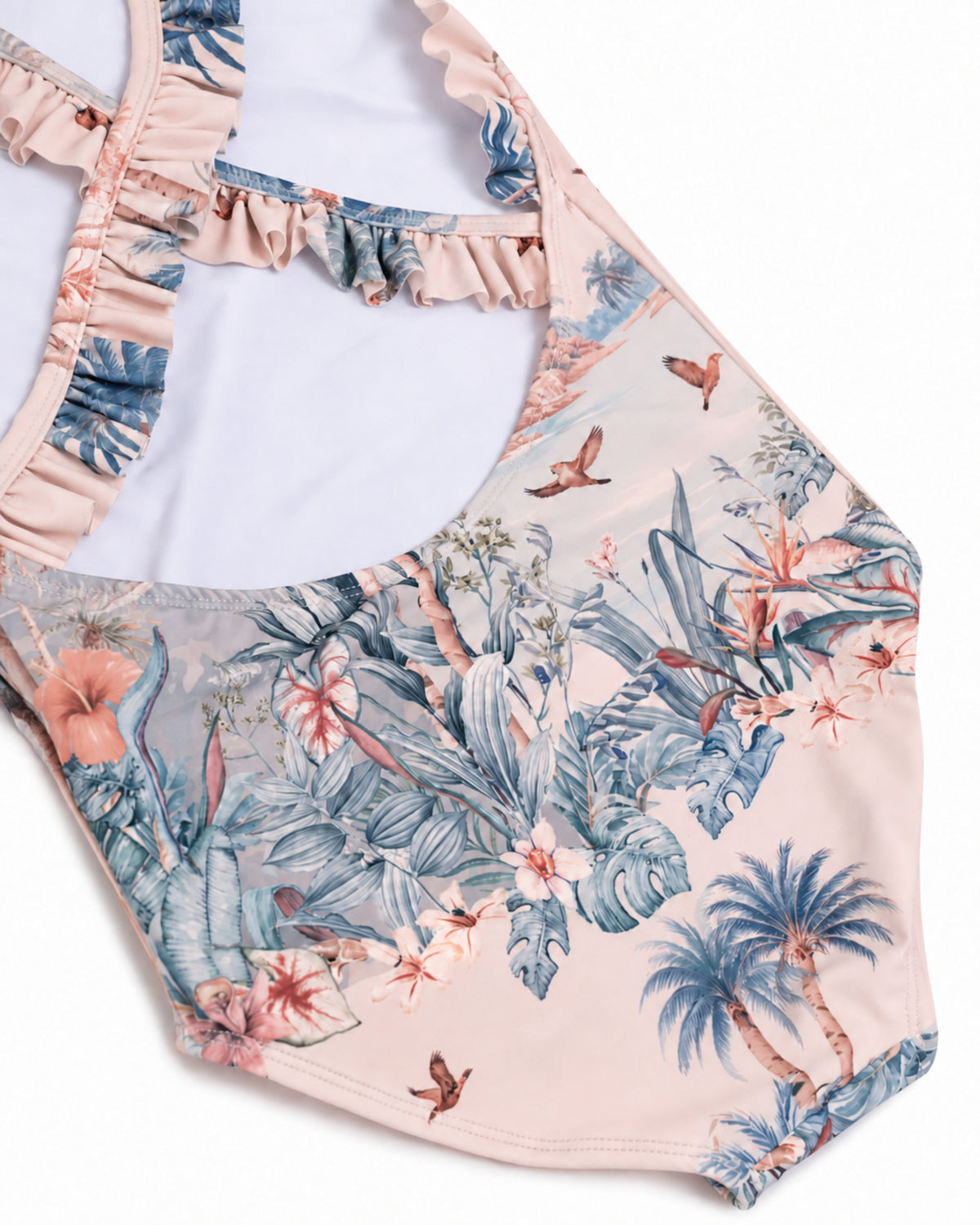 - Close-up of the crossed frill straps, low back and tropical jungle print on the Girls Frill Cross Back One Piece swimsuit