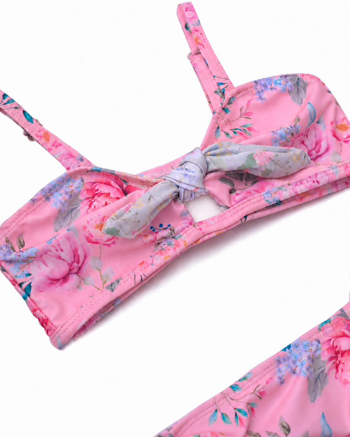 Close-up of the Olga Valentine Lilienne sweetheart bikini top, showing the floral tie and small opening beneath it.