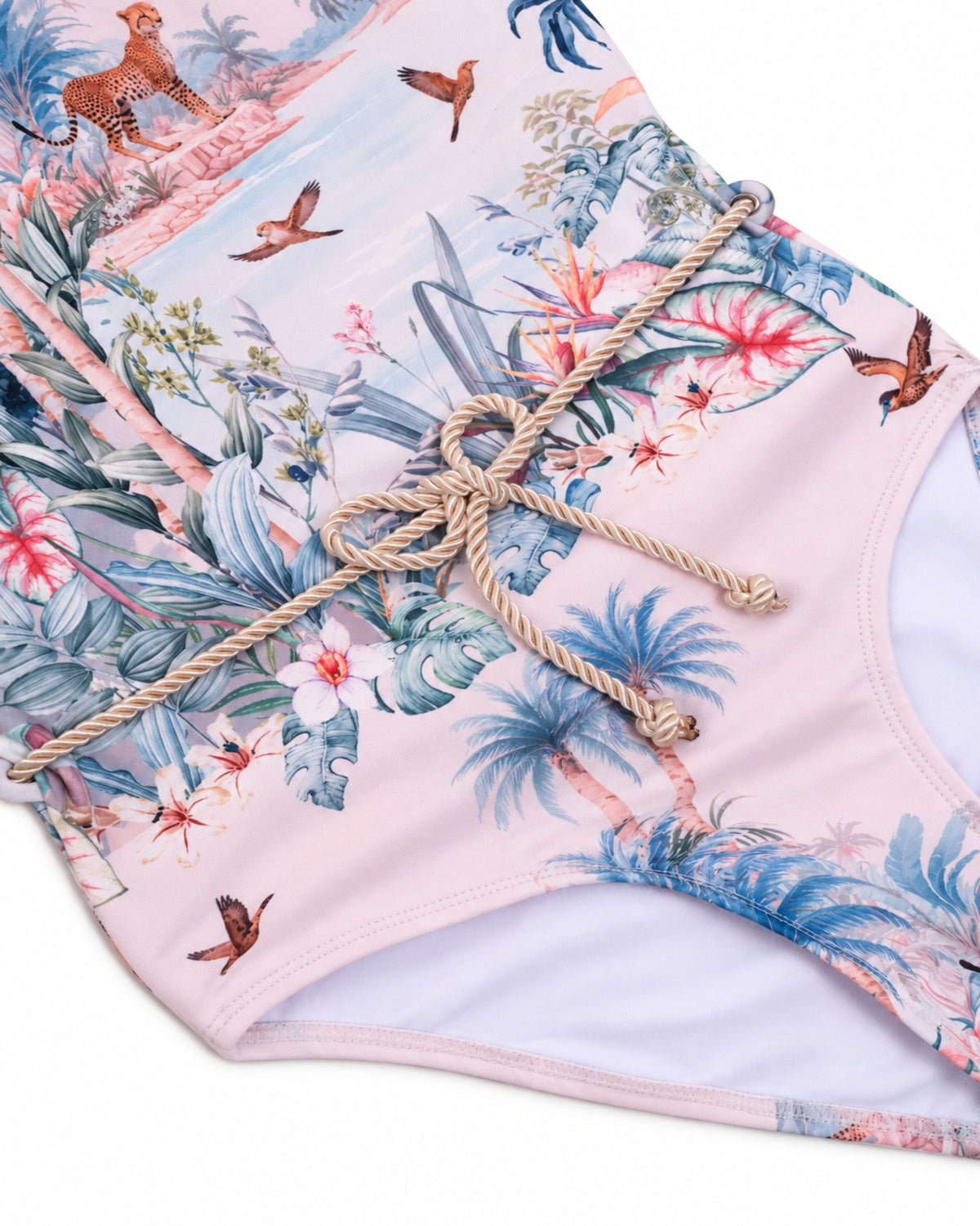 Close-up of braided belt and Wild Palms tropical print on the Girls T-Back One Piece Swimsuit