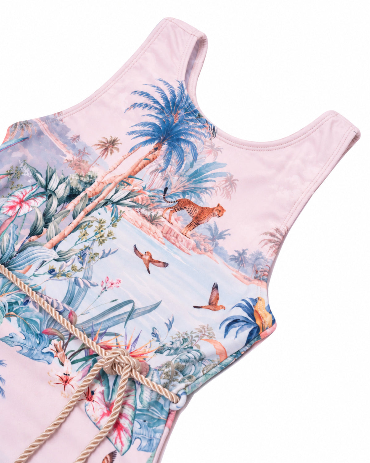 Close-up of the scoop neckline, Wild Palms tropical print and braided belt on the Girls T-Back One Piece Swimsuit