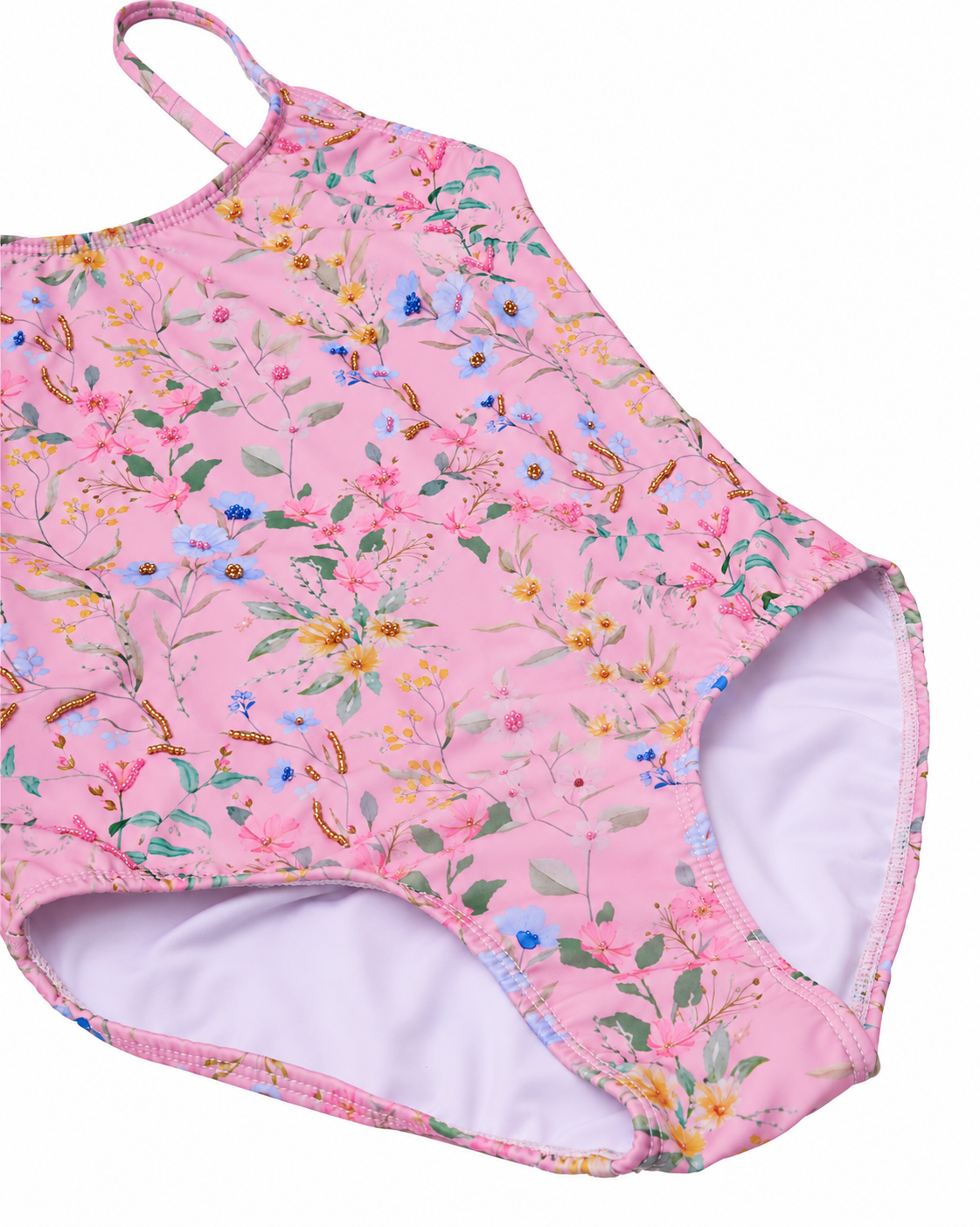 Close-up of the Primrose one-piece swimsuit’s floral print, hand beading, neckline and shoulder straps
