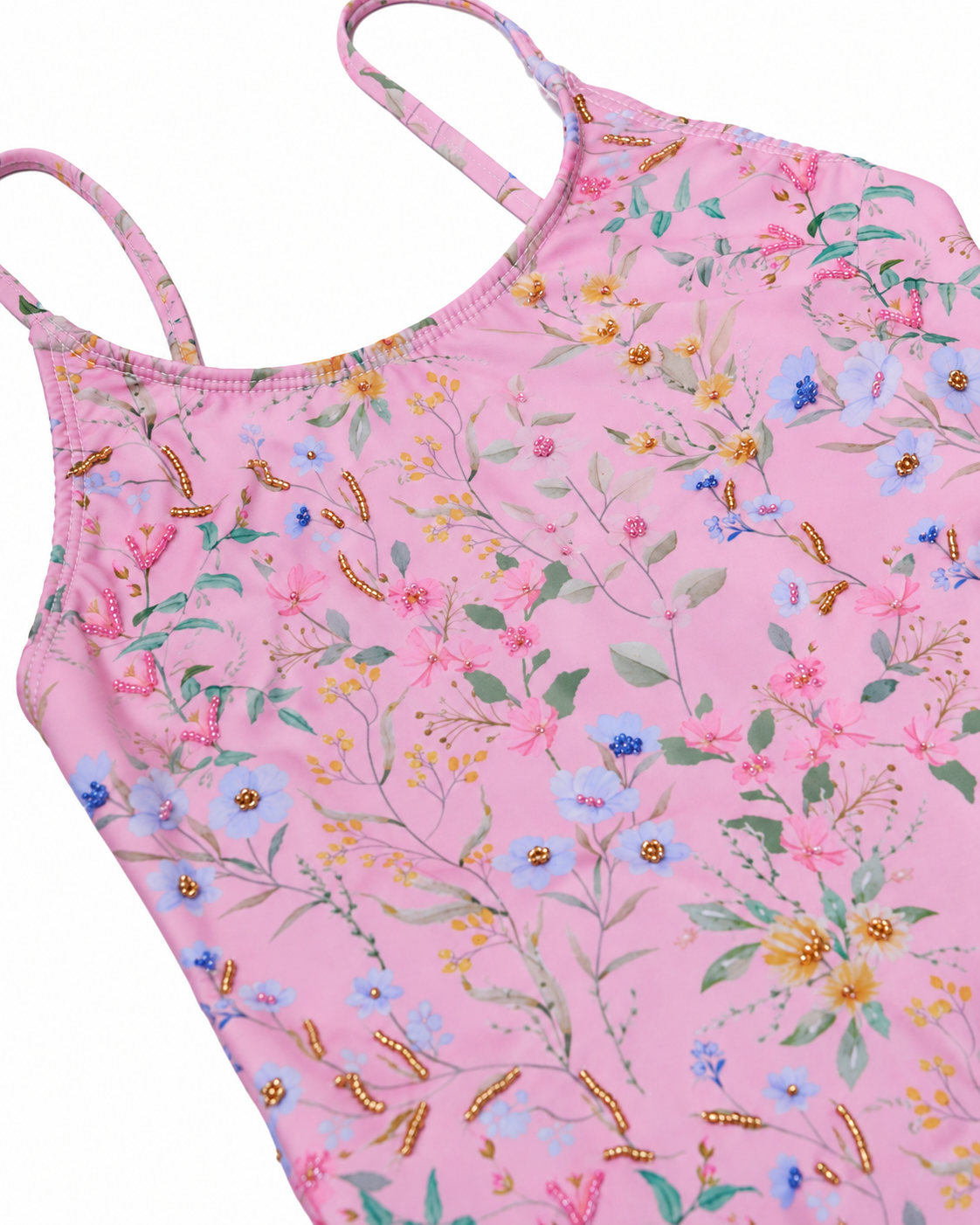 Detail of the hand-beaded flowers on the Primrose tie back one piece by Olga Valentine