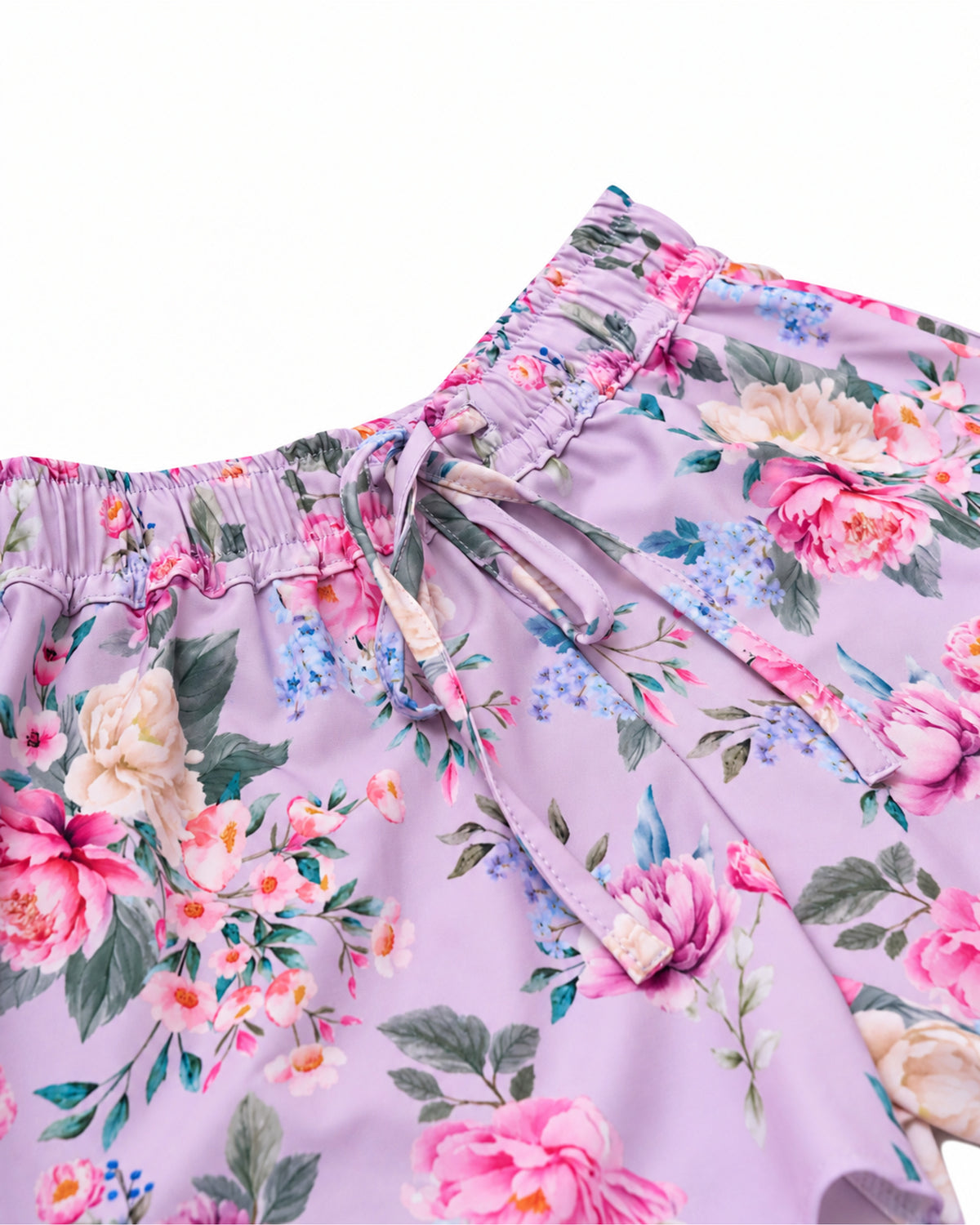 Close-up of the elastic waistband and drawstring on Violetta girls’ floral board shorts